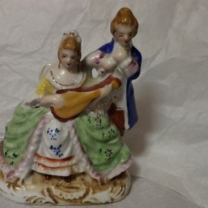 Victorian Man w/instrument & Woman Porcelain Figur